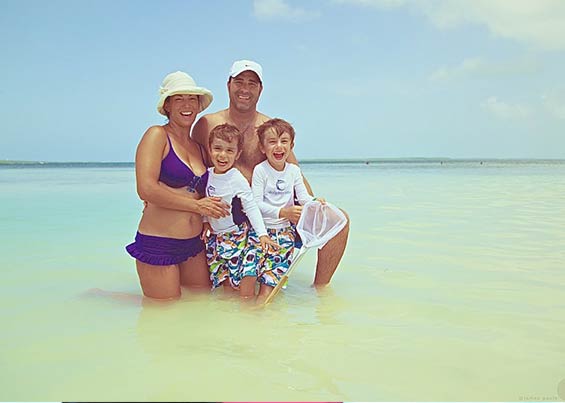 Family photo of Jeremy Fouts with his wife and two boys in the Bahamas